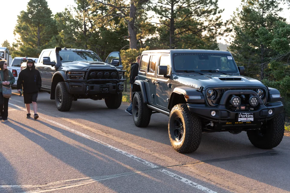 Jeep and truck meetup image captured during golden hour.